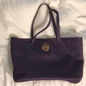Michael Kors medium sized purple tote bag.